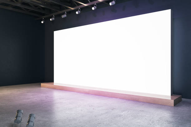 illuminated blank white billboard in interior with concrete flooring and mock up place for your advertisement. 3d rendering. - 数字展厅 個照片及圖片檔